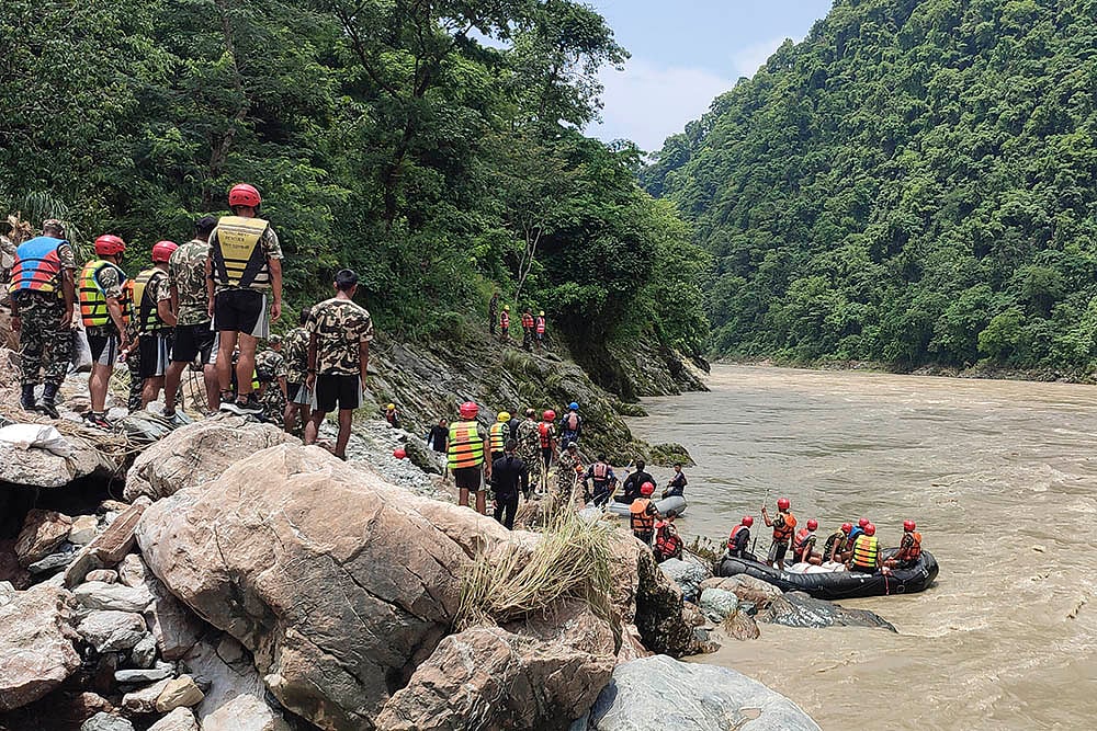 | Photo: AP/Ramesh Paudel : Buses swept away due to landslide in Nepal